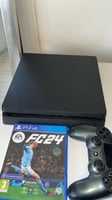 PlayStation 4 Slim avec 2 manettes et jeux FC24