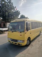 Bus 35 places à louer – Climatisé, sièges en cuir, idéal transport personnel