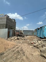 Terrain à vendre 120m au Centre-ville PK12 Pharmacie ARTA avec titre foncier / Négociable