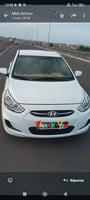 Hyundai Accent Blanche, climatisation, automatique, diesel à louer
