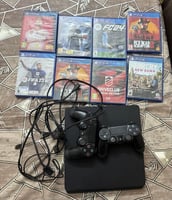 Console PS4 quasi neuve avec manette et 9 jeux originaux