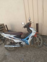 Moto Jincheng 110, état impeccable, cause voyage