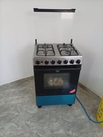 Gazinière 4 feux avec four et allumage électrique en bon état