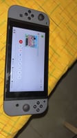 Nintendo Switch 1 en très bon état jamais utilisé