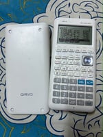 Calculatrice graphique blanche en excellent état avec garantie