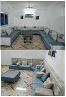 Salon complet en bon état avec table et tableaux