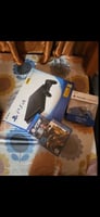 PS4 Slim avec CD FIFA 26, quasi neuve