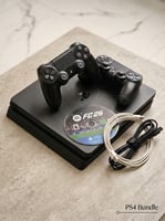 Console PS4 Slim avec 2 manettes et jeu EA Sports FC 26