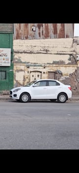 Voiture Suzuki Dzire avec climatisation, location à 7000 francs/jour