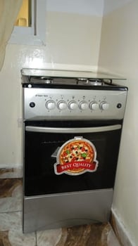Gazinière électrique et gaz neuve avec 4 plaques de cuisson et four