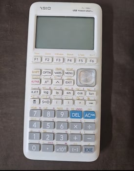 Calculatrice graphique blanche, pour le bac, en excellent état