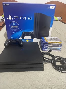 Console PS4 Pro noire avec manette et FIFA 25 intégré