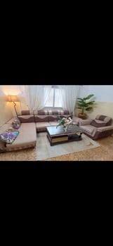 Canapé d\'angle 4 places beige avec fauteuil en bon état
