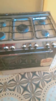 Cuisinière à gaz inox 5 brûleurs avec four intégré
