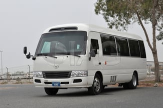 Location Toyota Coaster Bus avec chauffeur - Idéal écoles ou entreprises
