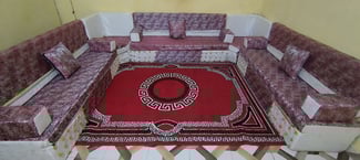 Salon Qaaci en U avec tapis, rideaux et table basse