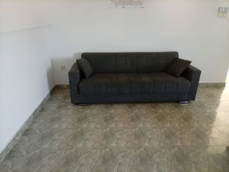 Canapé convertible gris en excellent état