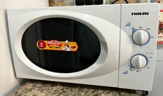 Micro-ondes Nikai blanc mécanique en bon état