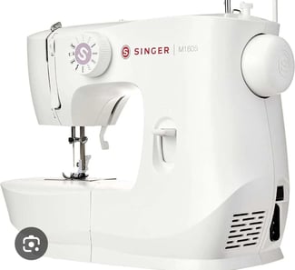 Machine à coudre électrique Singer en très bon état