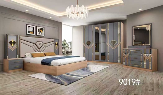 Lit double moderne gris avec tête de lit capitonnée et meubles assortis