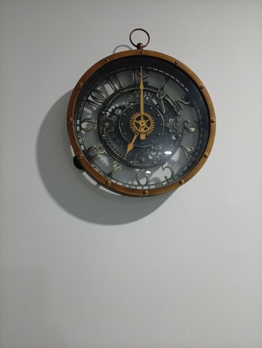 Jolie horloge 24cm de diamètre