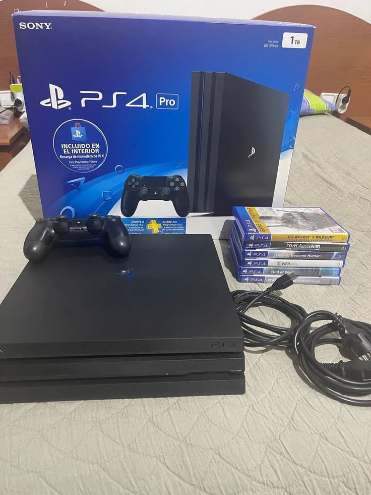 Console PS4 Pro noire avec manette et FIFA 25 intégré