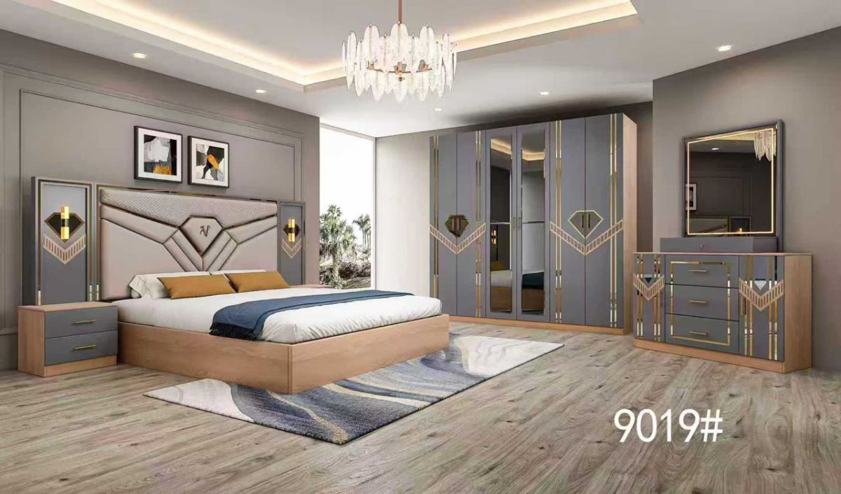 Lit double moderne gris avec tête de lit capitonnée et meubles assortis